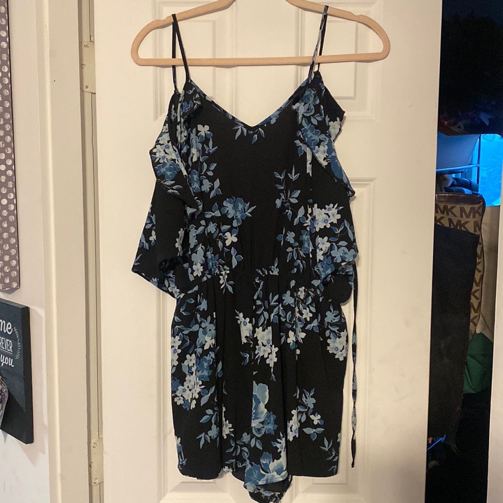 Charlotte Russe black romper with blue floral print. Like new.